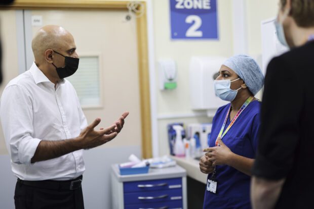 The Secretary of State for Health and Social Care, Sajid Javid speaks with an NHS staff member